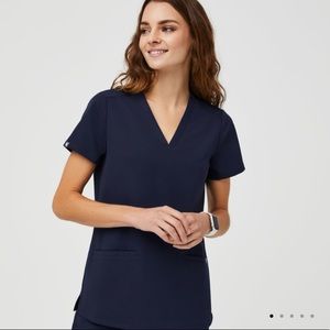 TWO sets of FIGS scrubs (tops + pants)